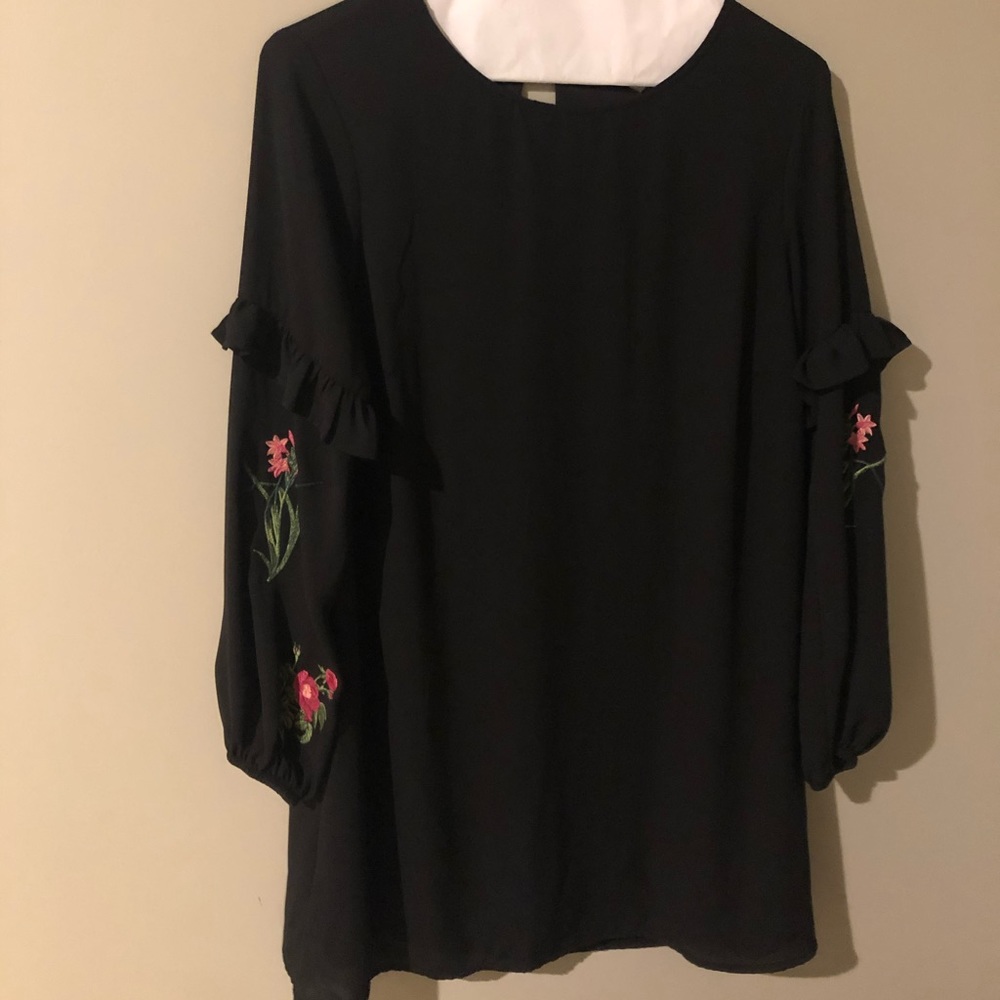 Black dress with flowers on the sleeves